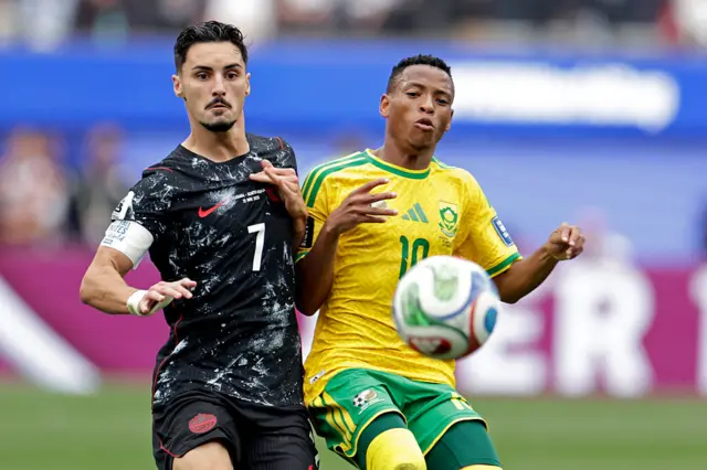 Relebohile Mofokeng and Stephen Eustaquio battle for the ball