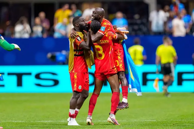 Arthur Masuaku #26 and Yoane Wissa #20 of Congo DR celebrate a win with teammates after the FIFA World Cup 2026 Group K match between Congo DR and Uzbekistan at Atlanta Stadium on June 27, 2026 in Atlanta, Georgia.