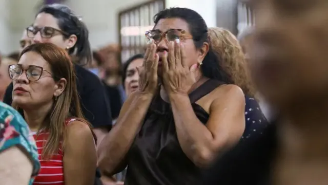 People attend a mass at the Santuario Nuestra Senora de los Dolores church in Valencia, Venezuela, during a national day of prayer for victims of the earthquakes