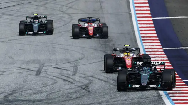 George Russell leading, Lewis Hamilton, Charles Leclerc and Kimi Antonelli