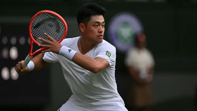 Wu Jibing hits a forehand