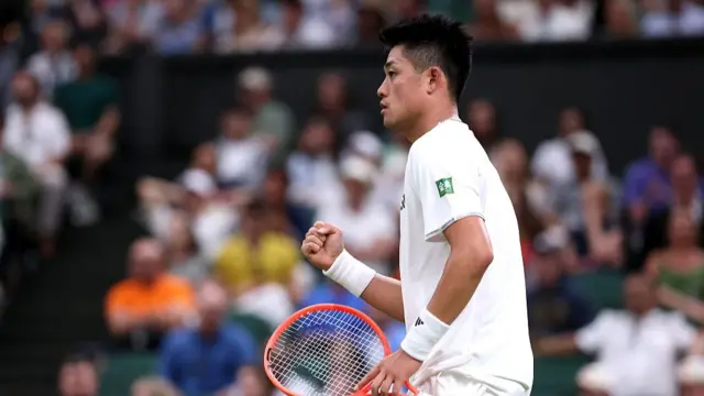 Yibing Wu celebrates