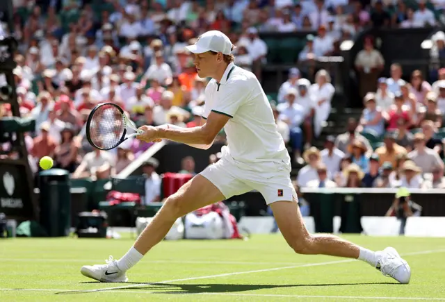 Jannik Sinner of Italy plays a backhand