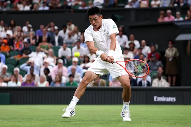 Yibing Wu plays a backhand