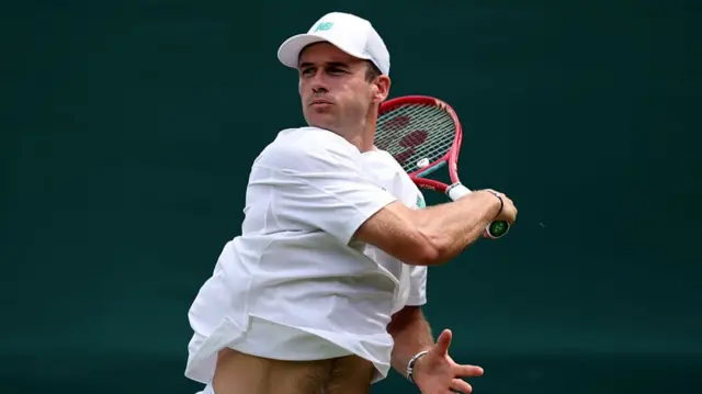 Tommy Paul of United States plays a forehand