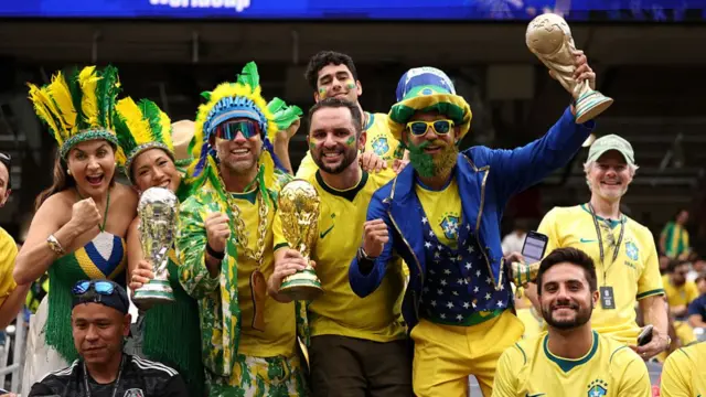 Brazil fans pose for photos as they arrive before the FIFA World Cup 2026 Round Of 32 match between Brazil and Japan at Houston Stadium.
