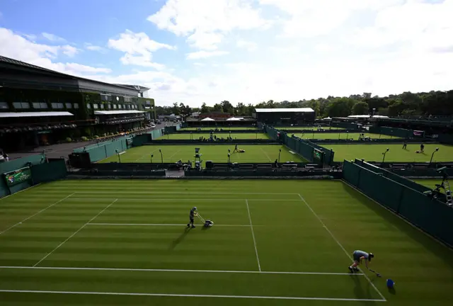Wimbledon staff paint the lines at Wimbledon