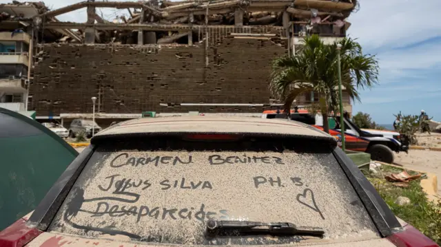 A list of names of missing persons is written on a car in an area affected by the earthquake in Catia La Mar, Venezuela, 28 June 2026