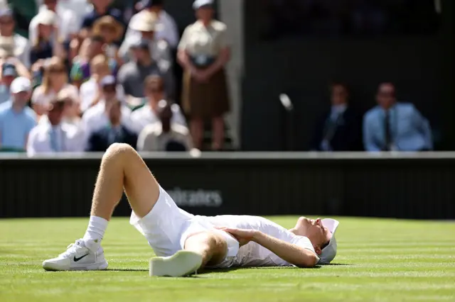 Jannik Sinner of Italy falls to the ground