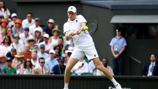 Jannik Sinner of Italy plays a backhand