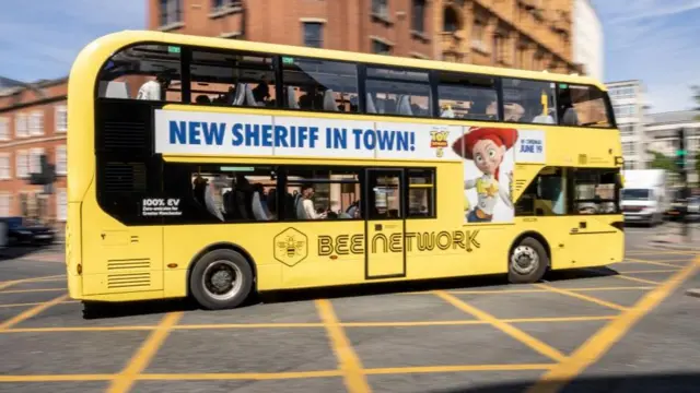 A Manchester "Bee Network" bus, seen last week. There is an advert for the Toy Story move saying "New Sheriff in Town" on the side