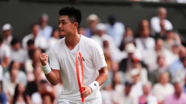 Yibing Wu celebrates