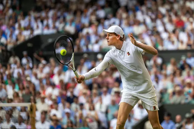 Jannik Sinner hits a tennis ball