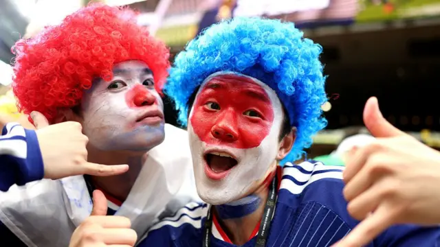 : Japan fans pose for photos