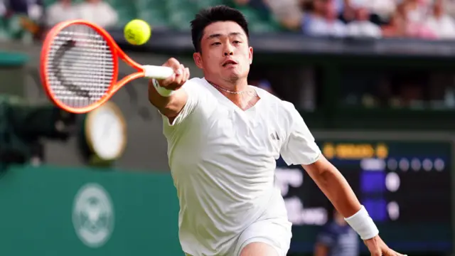 Yibing Wu plays a forehand