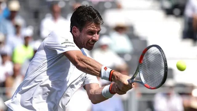 Cameron Norrie in action against Jannik Sinner