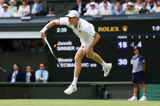 Jannik Sinner of Italy serves