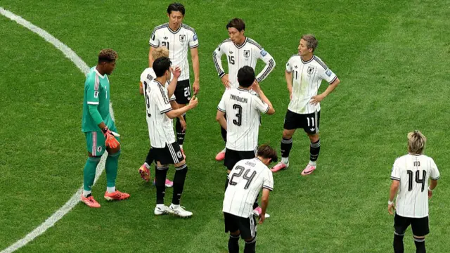 Japan players react after conceding a first goal to Casemiro #5 of Brazil during the FIFA World Cup 2026 Round Of 32 match between Brazil and Japan.