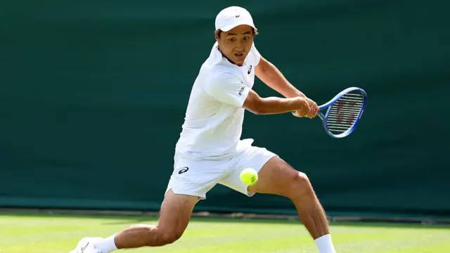 Shintaro Mochizuki of Japan plays a backhand