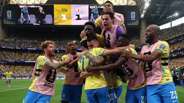Gabriel Martinelli #22 of Brazil celebrates with teammates after scoring the team's second goal