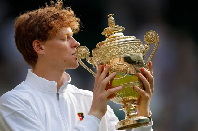 Jannik Sinner kisses the Wimbledon title