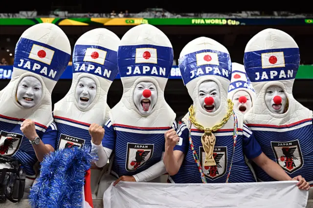 Japan fans pose for a picture