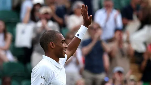 Felix Auger-Aliassime of Canada acknowledges the crowd after victory