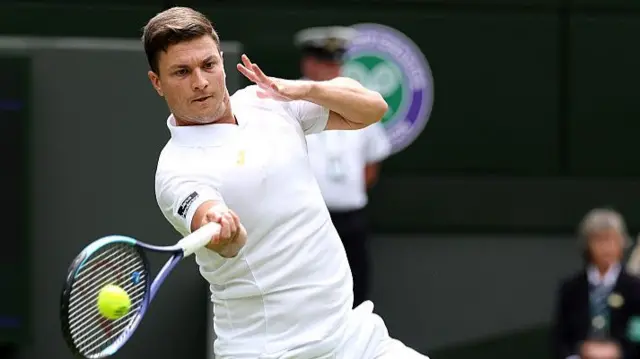 Miomir Kecmanovic of Serbia plays a forehand