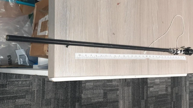 A black, homemade blowpipe