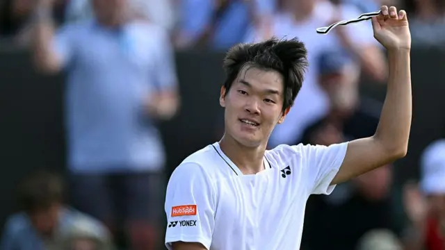Michael Zheng celebrates