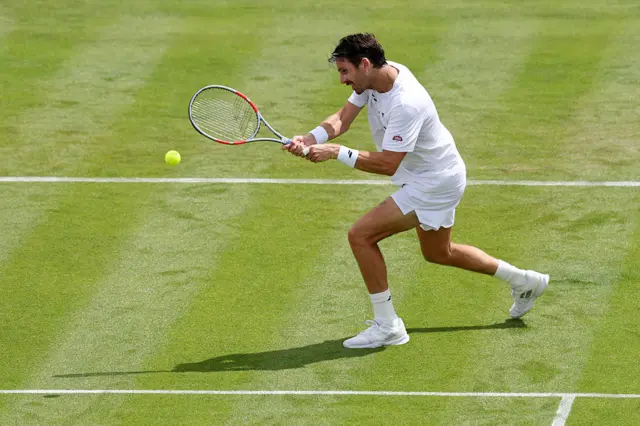 Cameron Norrie of Great Britain plays a backhand