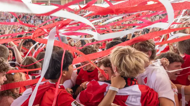 Fans cheer on Canada and the winning goal versus South Africa in the round of 32 match at the Vancouver FanFestival