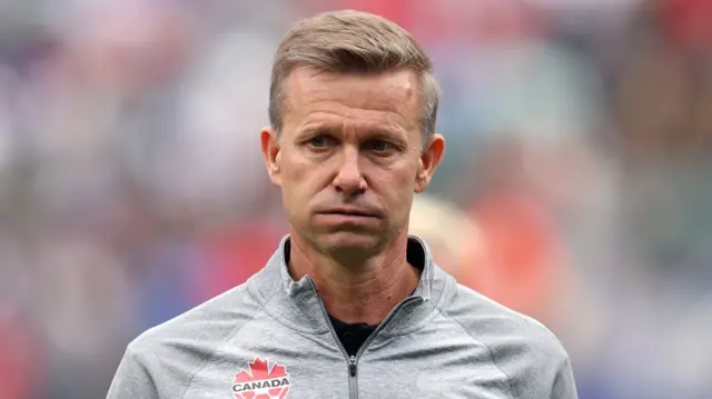 Canada manager Jesse Marsch. He is wearing a grey Canada tracksuit.