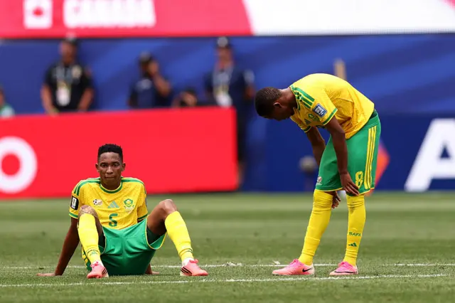 Thalente Mbatha and Tshepang Moremi of South Africa look dejected