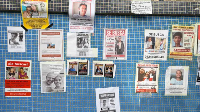 A wall of an hospital covered in missing posters following earthquakes in Venezuela