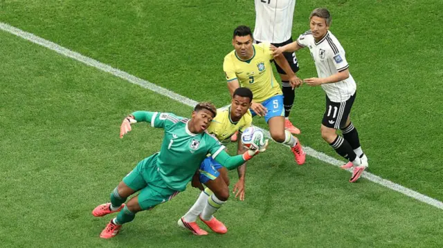 Zion Suzuki #1 of Japan makes a save against Gabriel Magalhaes #3 of Brazil during the FIFA World Cup 2026 Round Of 32 match between Brazil and Japan.