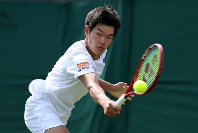 Michael Zheng of United States plays a backhand