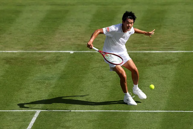 Michael Zheng of United States plays a backhand
