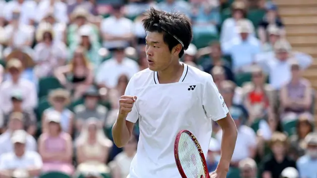 Michael Zheng of United States celebrates a point