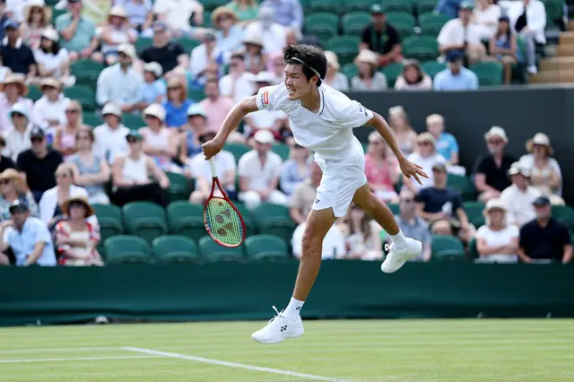Michael Zheng of United States serves