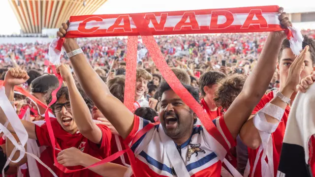 Fans cheer on Canada and the winning goal versus South Africa in the round of 32 match at the Vancouver FanFestival
