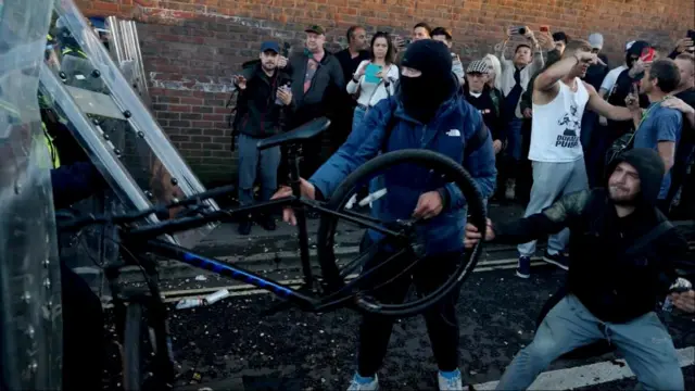 Screen grab taken from PA Video of police and protestors clashing in Southampton during a protest following the death of Henry Nowak.