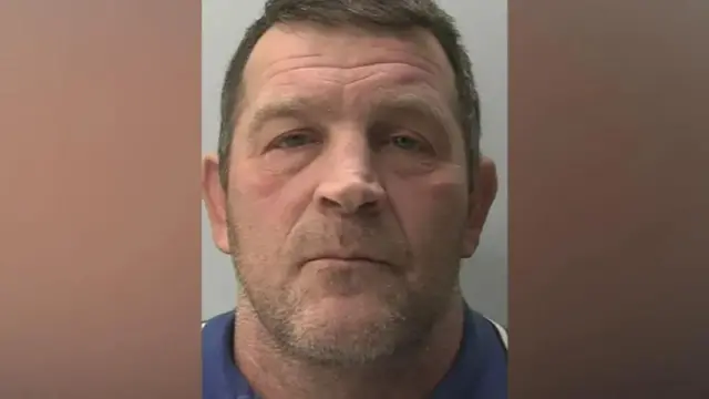 A mug shot taken of Paul Quinn.