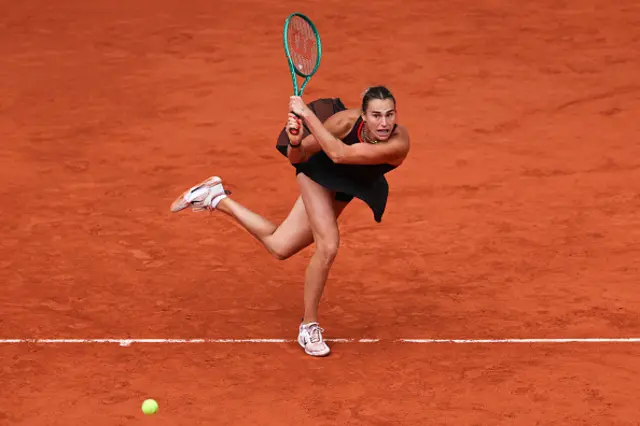 Aryna Sabalenka plays a backhand return