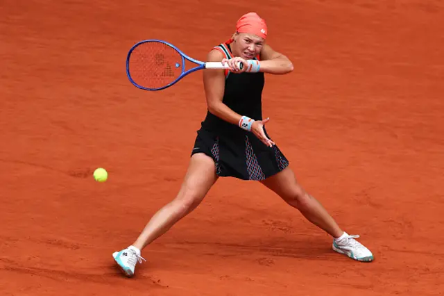 Diana Shnaider plays a forehand return to Aryna Sabalenka