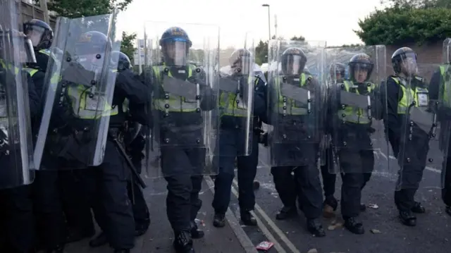 riot police with shields