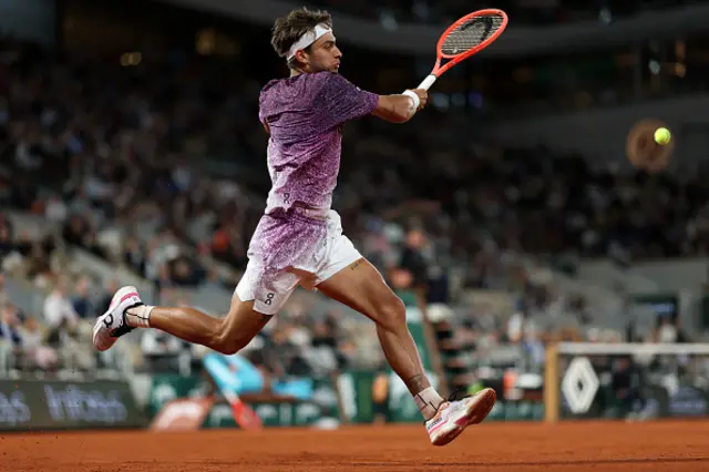 Flavio Cobolli of Italy plays a forehand