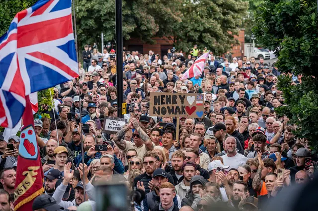 Demonstrators outside Southampton Central Police Station holding placards on Tuesday
