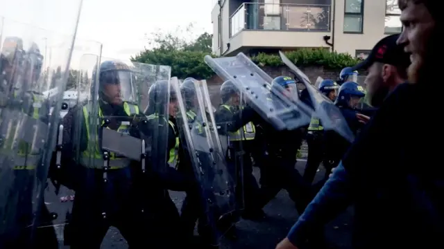 Police in riot gear clashing with protesters in Portswood