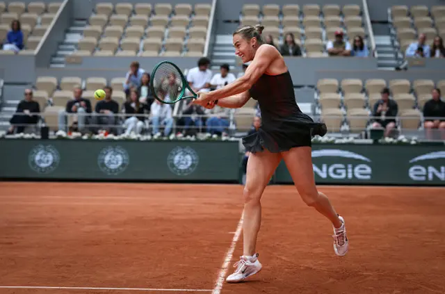 Aryna Sabalenka plays a backhand return
